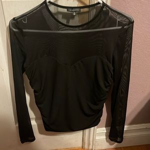 Dynamite black shirt with a sheer top and arms size medium